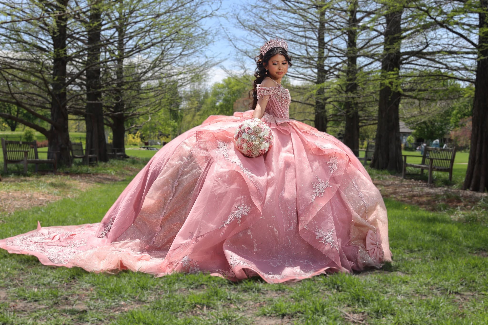 Quinceanera portrait in an elaborate pink gown