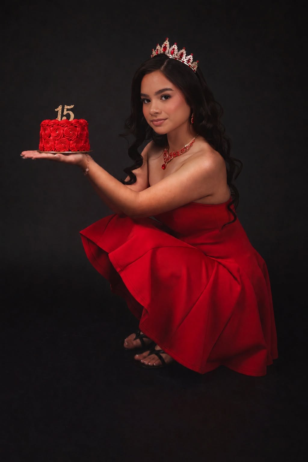 Quinceañera portrait in a red gown and crown
