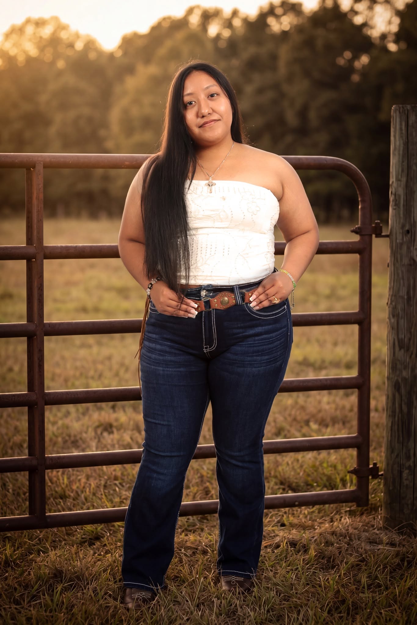 Outdoor portrait at a ranch gate